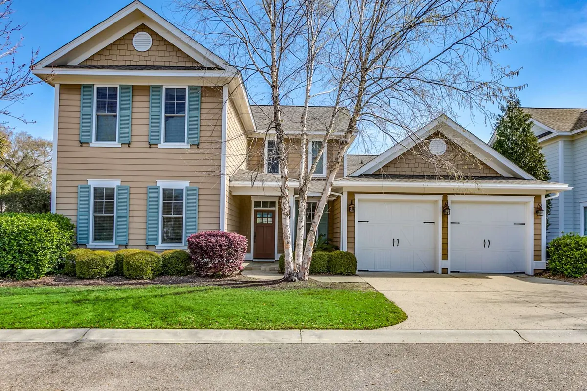 A cheerful exterior shot of the home's front facade, with a welcoming entrance, landscaped bushes, and space for children to play in the yard. The inviting atmosphere hints at family gatherings, morning coffees on the porch, and evening barbecues.